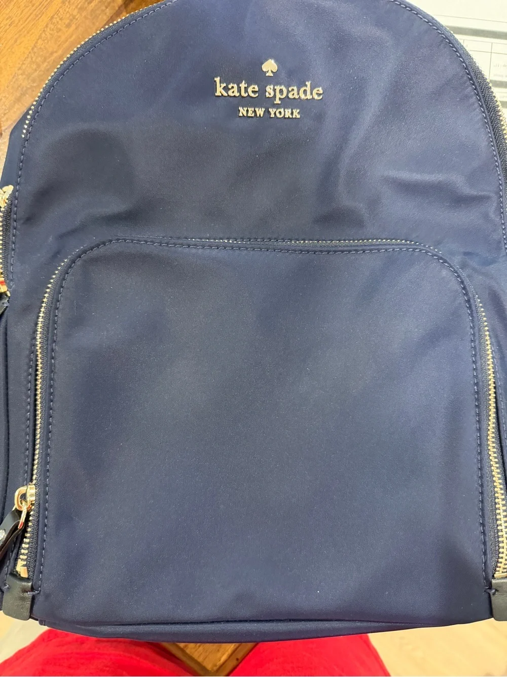 kate spade navy blue nylon backpack with gold hardware